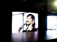 rihanna singing on a television screen